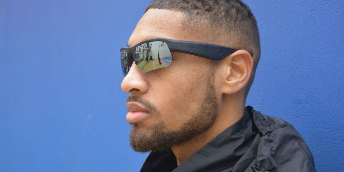 athlete wearing wrap around sports style vocalskull bone conduction sunglasses